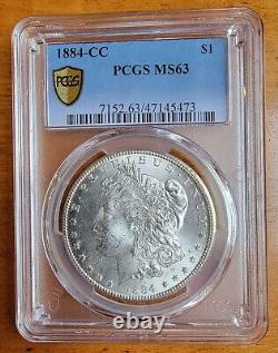 1884-CC Gold Shield PCGS MS63 Morgan Silver Dollar With Light Reverse Toning